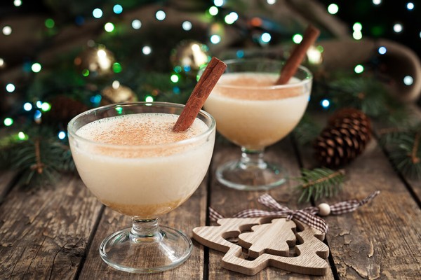 Traditional Christmas eggnog drink in a festive glass, made with Canadian milk and cream