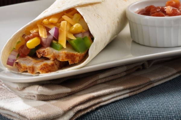 Chicken fajitas rolled in tortillas with corn, peppers, salsa, and melted Canadian cheddar