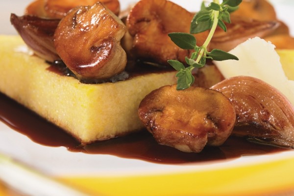 polenta made with old cheddar and topped with caramelized shallots and mushrooms