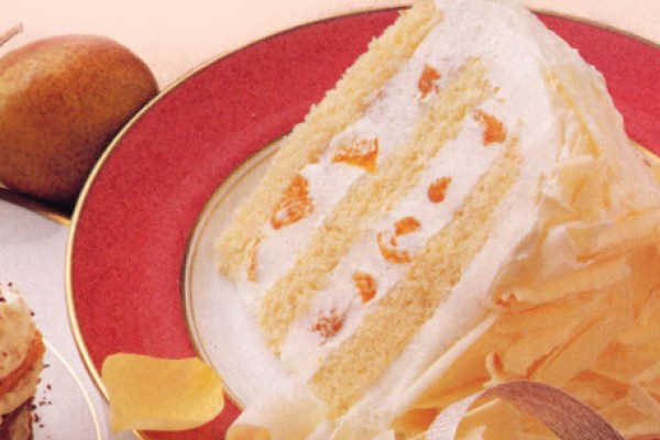 A slice of heavenly white chocolate mousse cake on a plate.