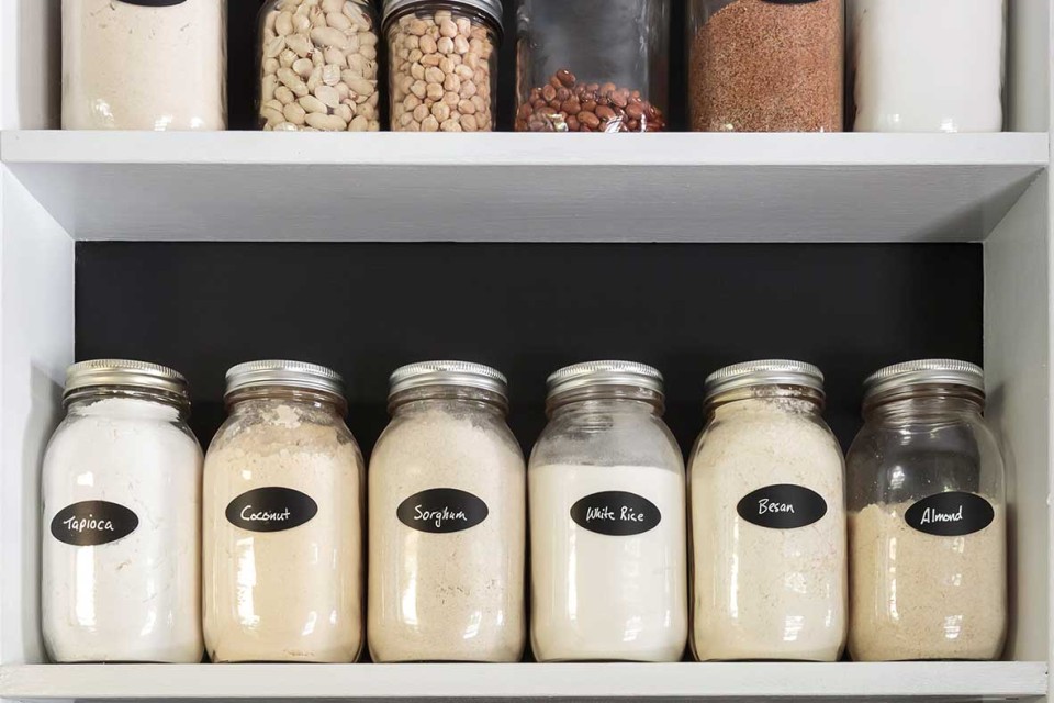 Pantry filled with label jars of non-perishable items.