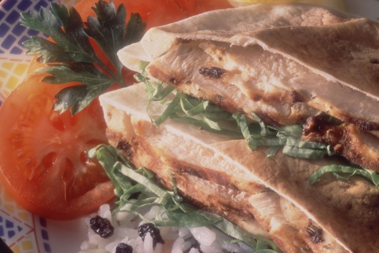 Shish taouk chicken skewers served with rice and pita bread