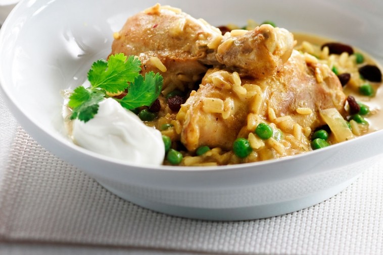 Chicken curry served with rice in a bowl