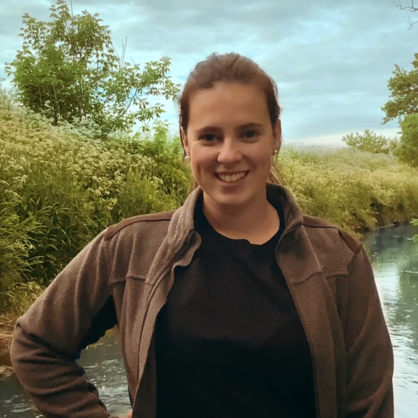 Dairy farmer in front of wetlands